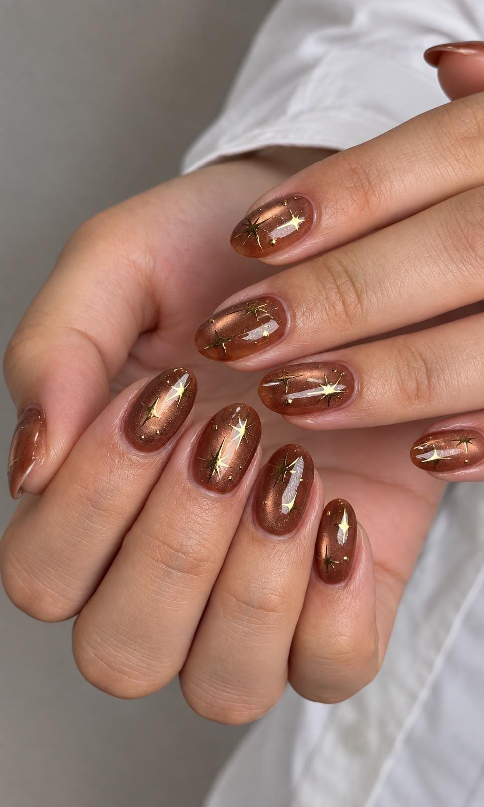 Amber Brown Cat Eye Press-On Nails with Gold Starburst Accents