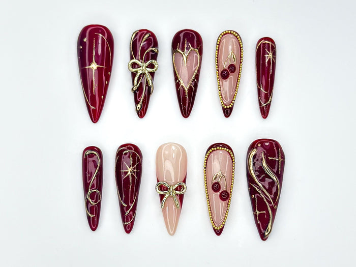 Autumn Burgundy and Nude Press On Nails with Gold Linework, Bows, Cherries, and Stars