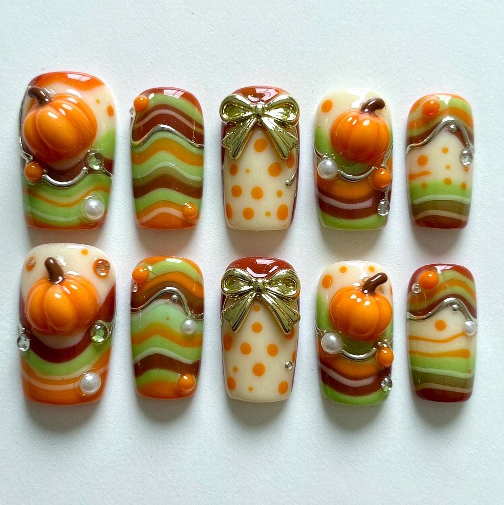 Autumn Pumpkin Nails With Wavy Orange and Green Bands, Pearls and Gold Bows