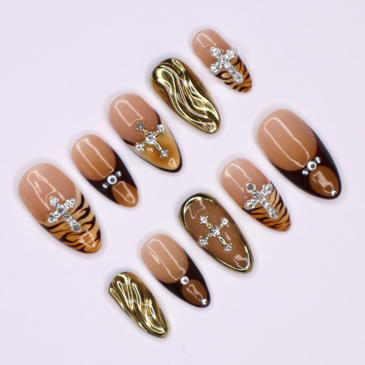 Autumn Tiger Print French Tip Nails with Rhinestone Crosses and Gold Chrome