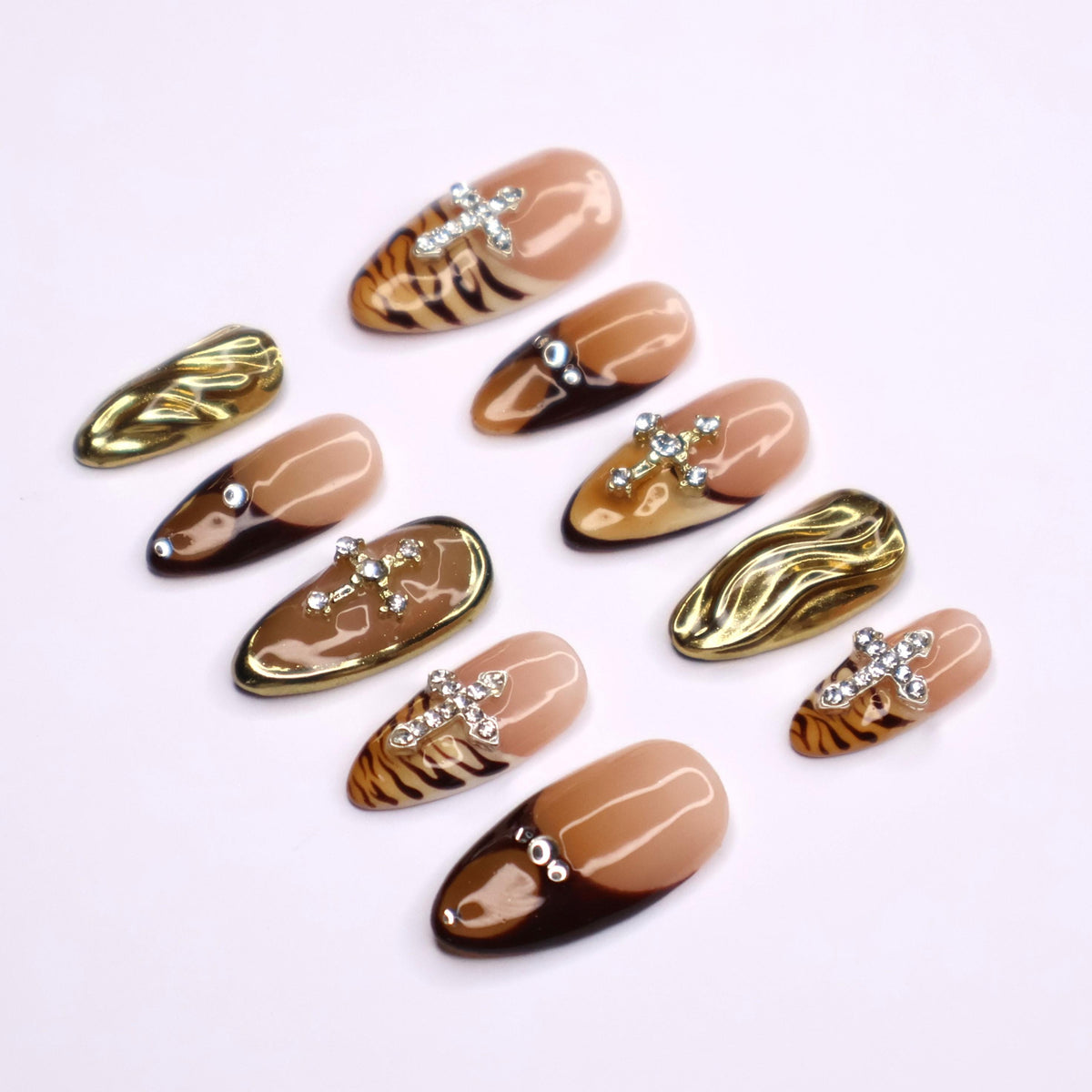 Autumn Tiger Print French Tip Nails with Rhinestone Crosses and Gold Chrome