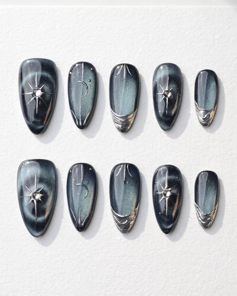 Black and Navy Cat Eye Nails with Chrome Starbursts and Metallic French Tips