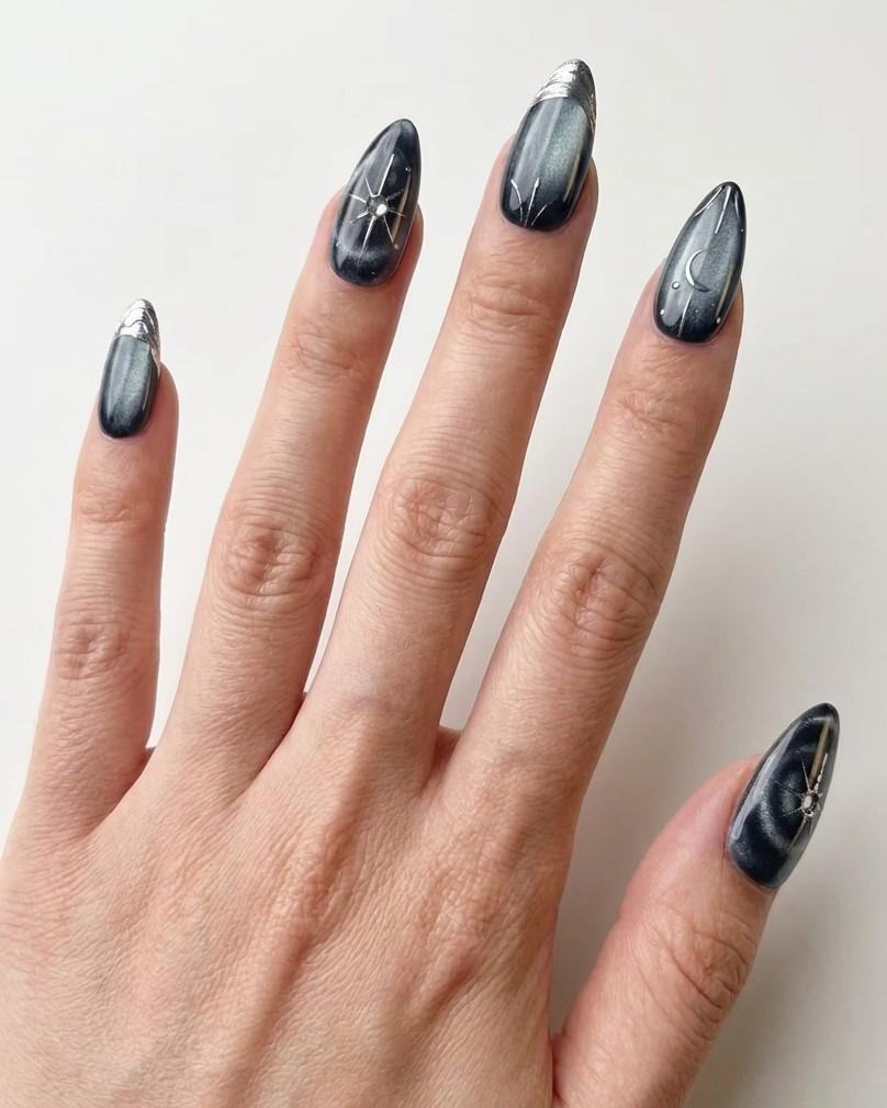 Black and Navy Cat Eye Nails with Chrome Starbursts and Metallic French Tips