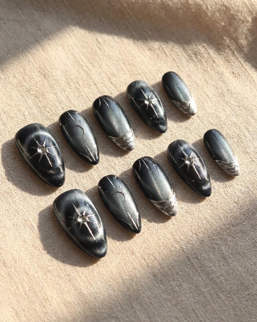Black and Navy Cat Eye Nails with Chrome Starbursts and Metallic French Tips