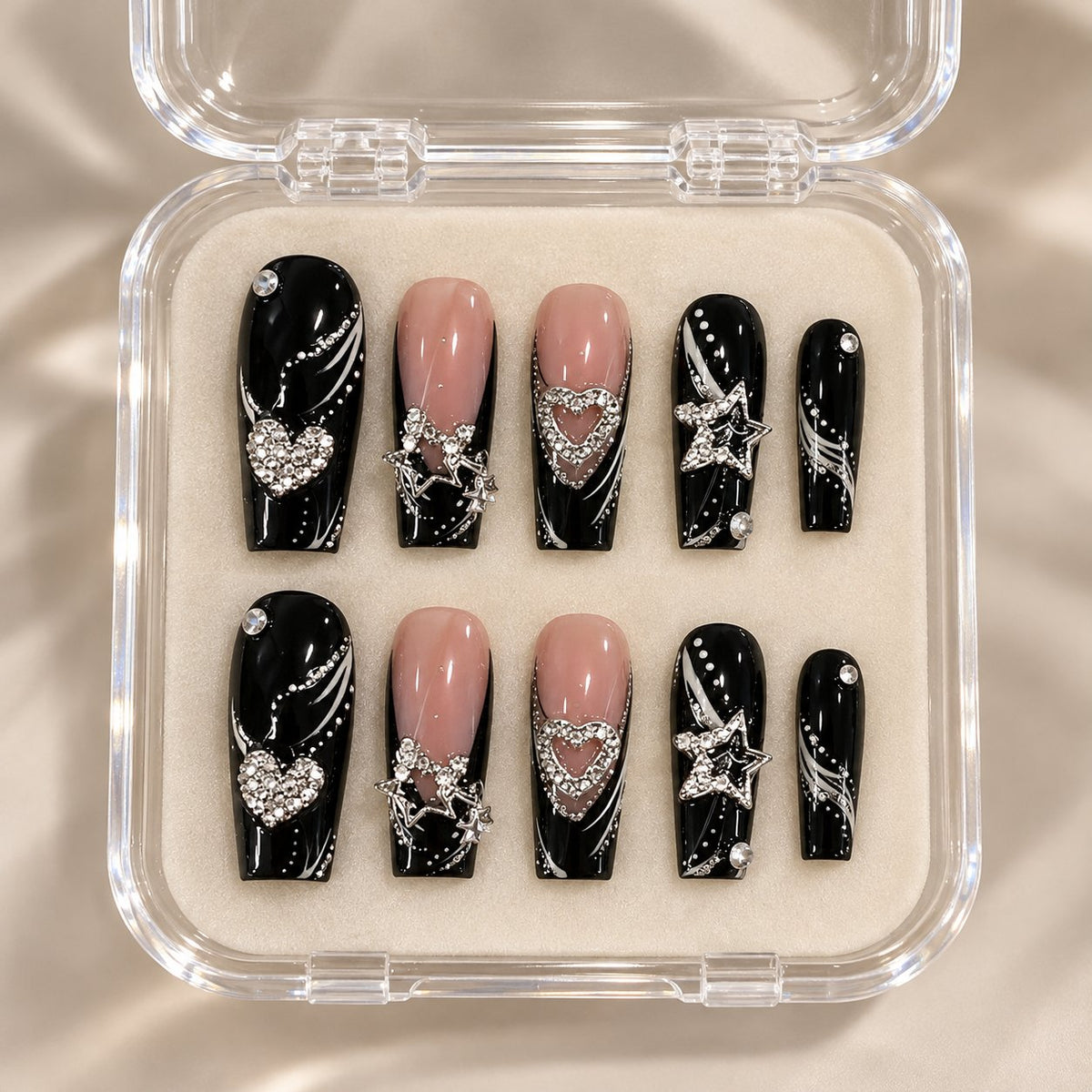 Black and Nude French Tip Press On Nails with Silver Heart Rhinestones in clear acrylic storage box