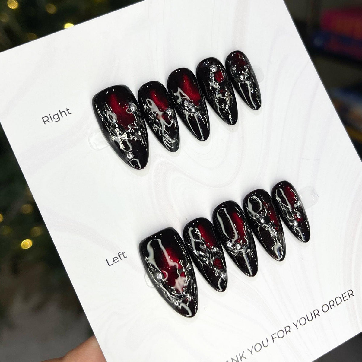 Black and Red Cat Eye Nails with Silver Molten Veining and Cross Accents