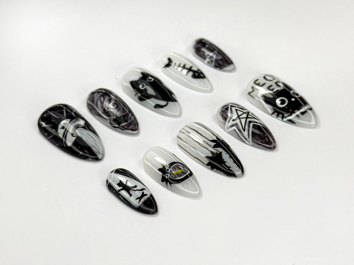 Black and White Cosmic Cat Nail Set with Stars and Spooky Motifs