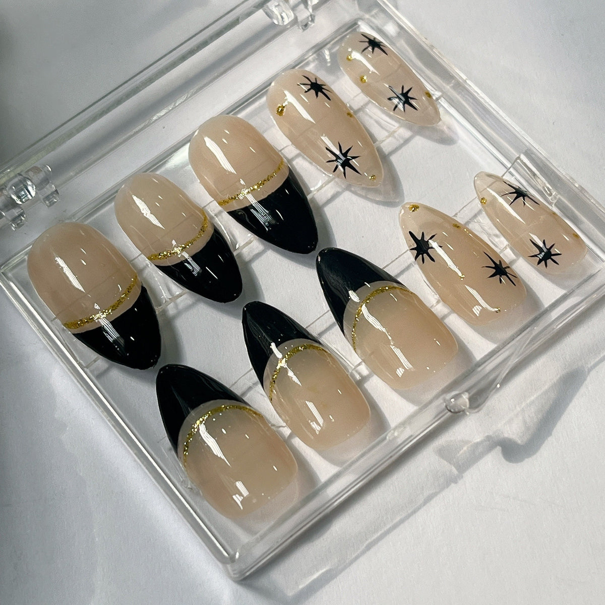 Black French Tip Press On Nails With Gold Glitter and Starburst Accents