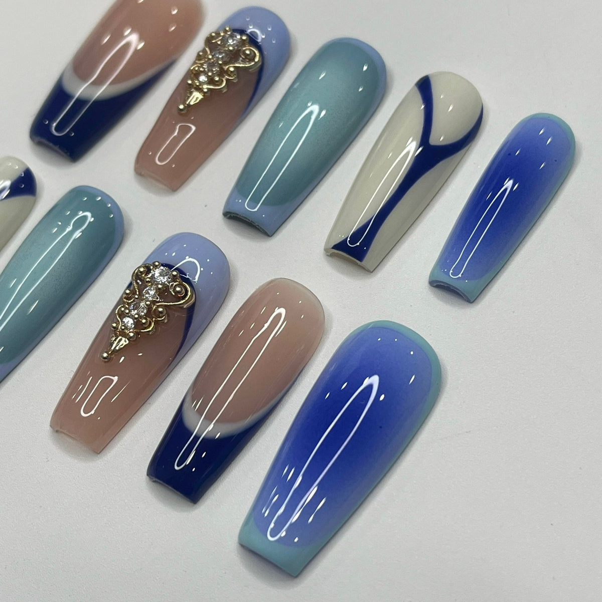 Blue and Taupe Press-On Nails with Gold Embellishments and Rhinestones