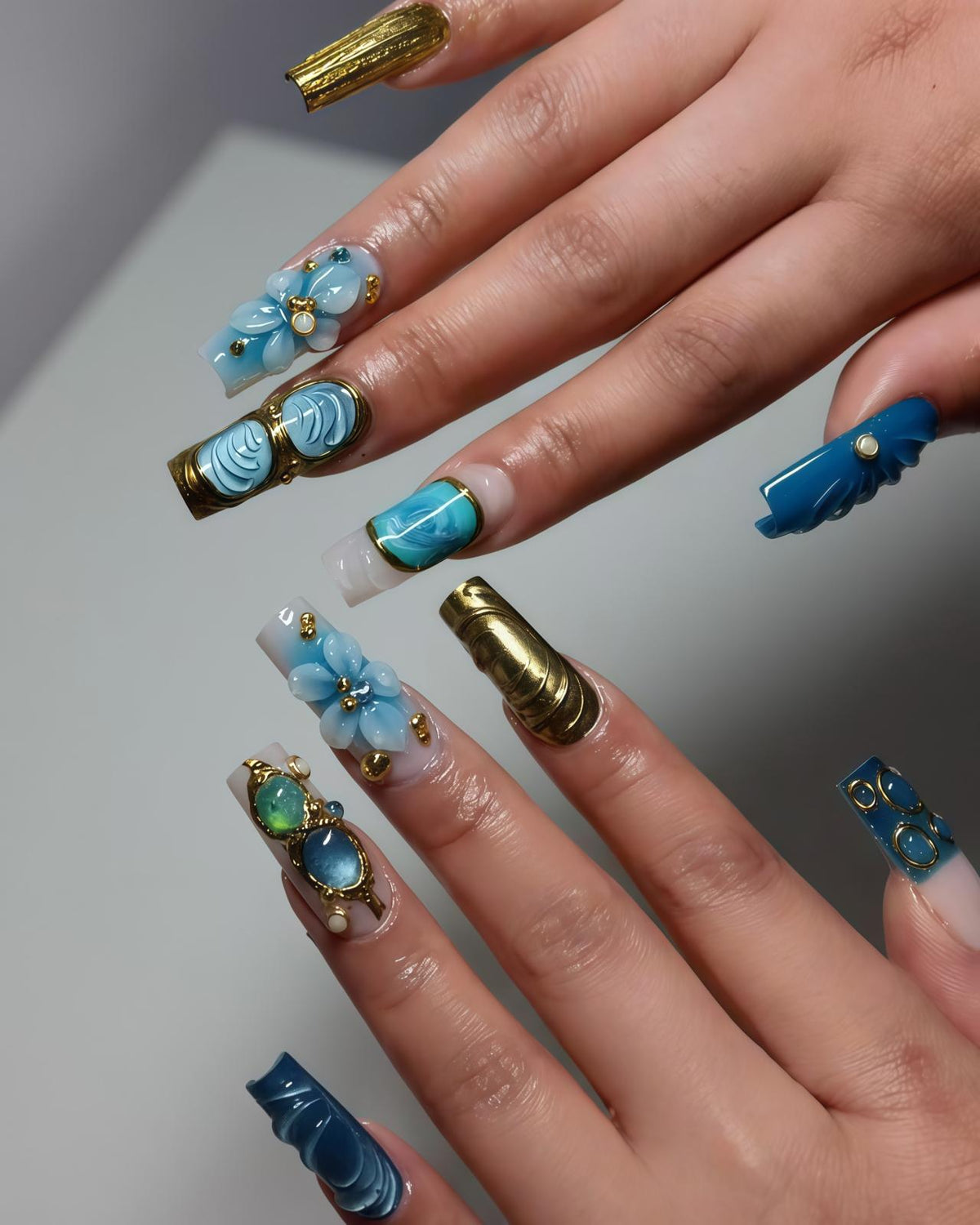 Blue Sculpted Flower and Gold Nail Set With Jeweled Accents