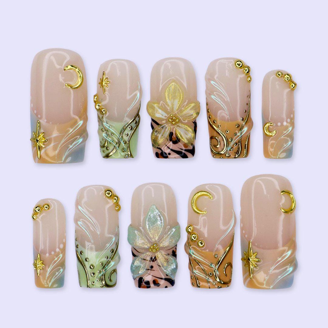 Blush Nude Celestial Floral Nails With Gold Chrome and Animal Print