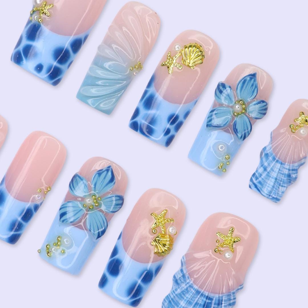 Blush Pink and Blue Ocean Nails with Tropical Flowers, Shells and Gold Charms