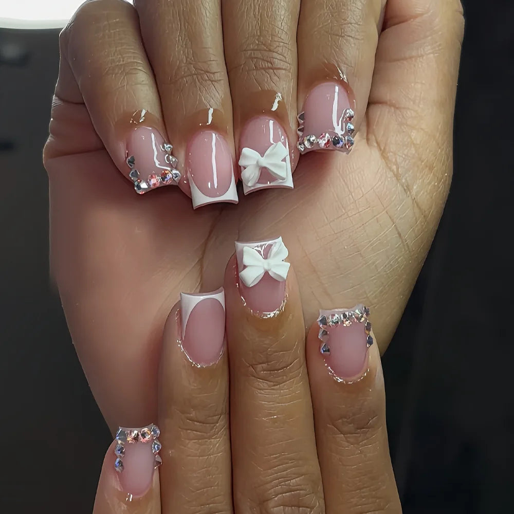 Blush Pink French Tip Nails With 3D White Bows and Rhinestones