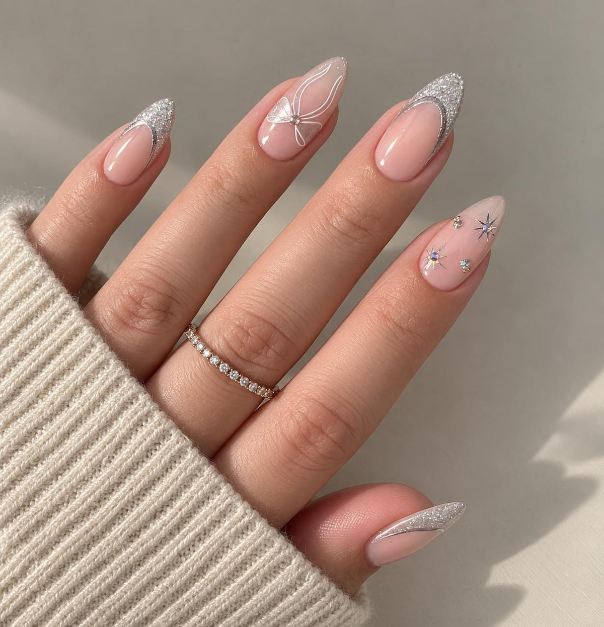 Blush Pink Nails With Silver Glitter French Tips, White Bow and Starbursts