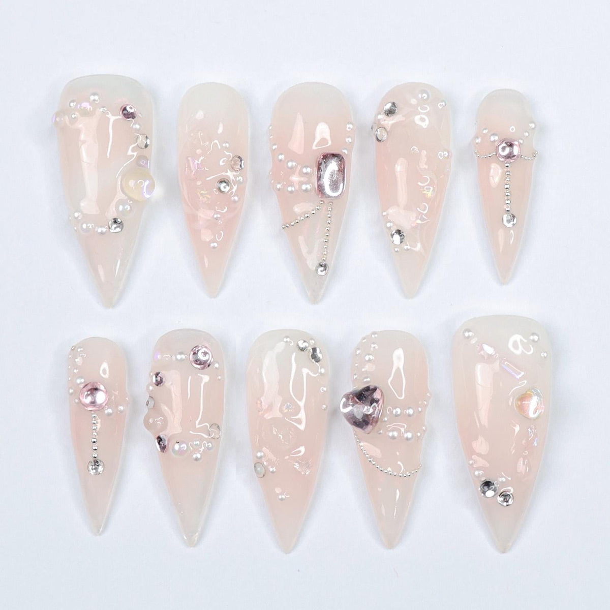 Blush Pink Pearl and Rhinestone Nails with Metallic Charms for Weddings