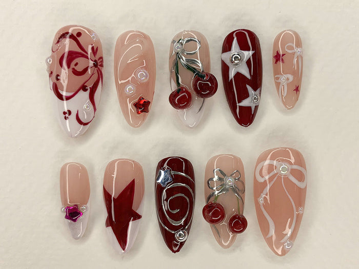 Burgundy and Blush Cherry Press On Nails with White Linework, Stars, Bows and Silver Charms