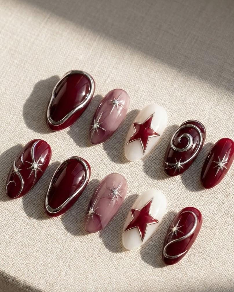 Burgundy and Mauve Celestial Star Nail Set With Silver Swirls