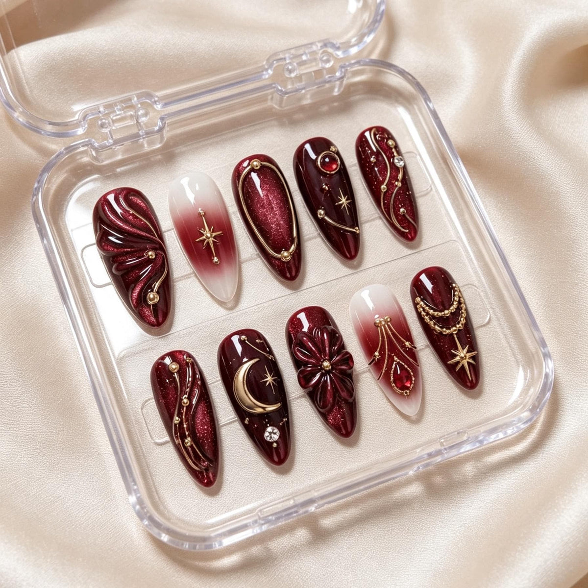 Burgundy Celestial Nail Set with Gold Moons, Starbursts, and Sculpted Flowers