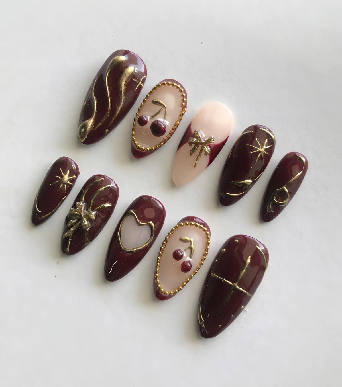 Burgundy Cherry Press-On Nails with Gold Linework, Bow, Heart and Beaded Accents