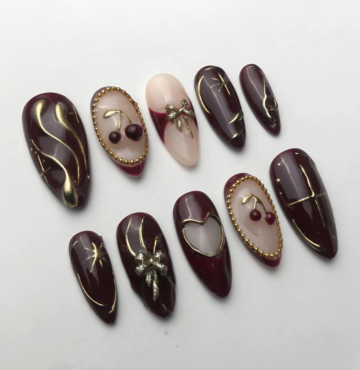 Burgundy Cherry Press-On Nails with Gold Linework, Bow, Heart and Beaded Accents