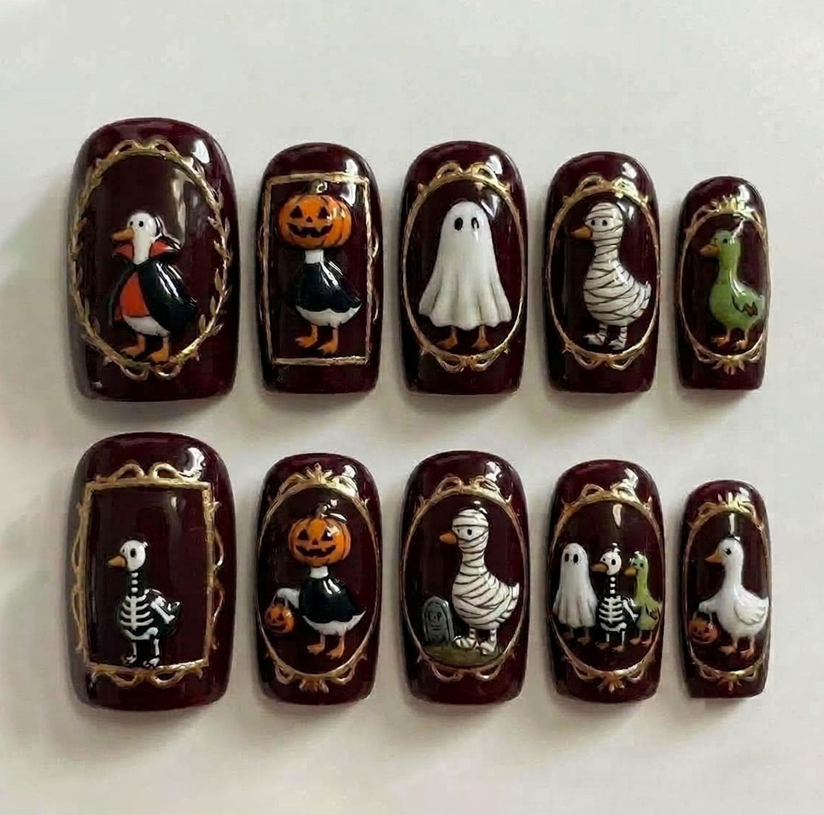 Burgundy Halloween Bird Portrait Press-On Nail Set With Ornate Gold Frames