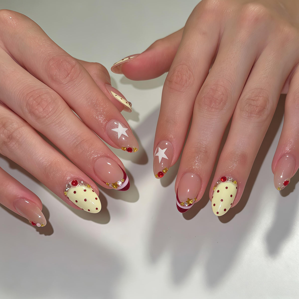 Burgundy Polka Dot French Tip Nail Set with Stars and Gold Accents
