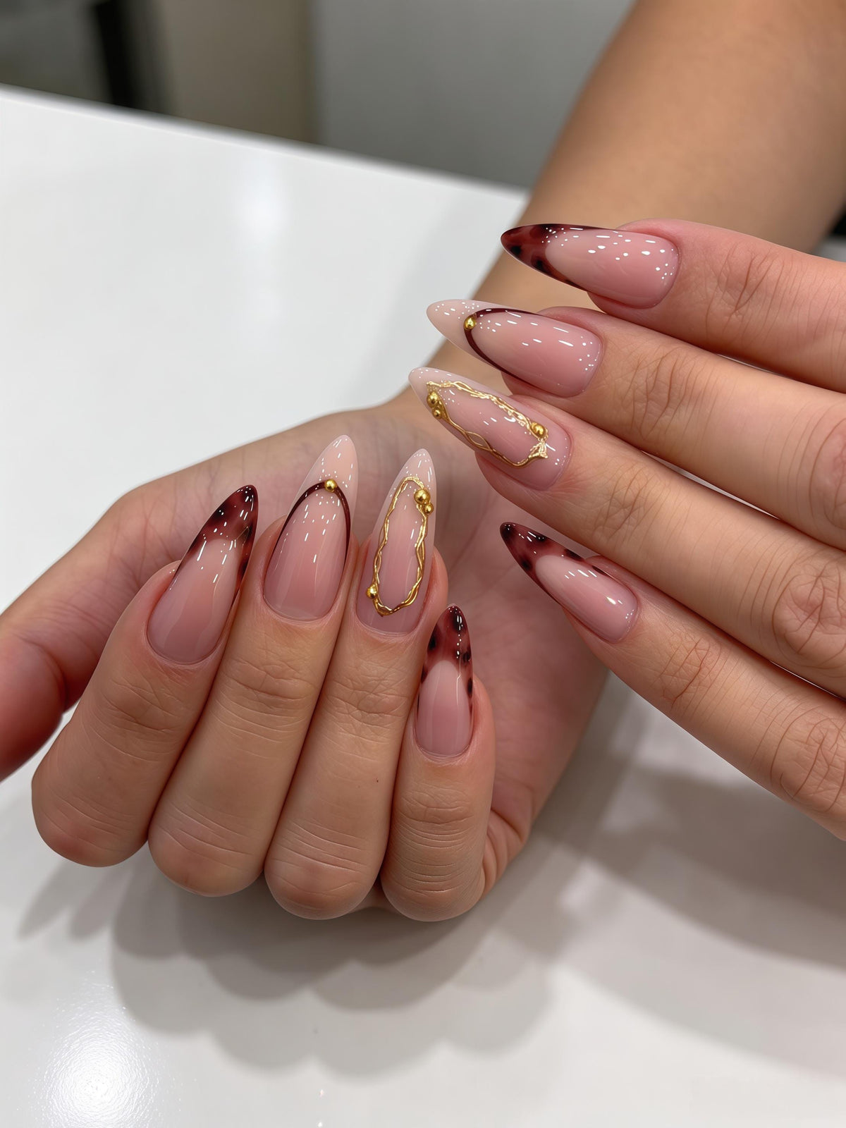 Burgundy Tortoiseshell French Tip Nails With Gold Chain Details