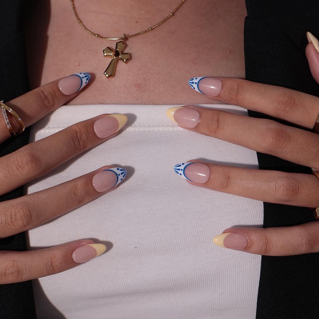 Butter Yellow French Tip Nails With Blue-Edged White Tips and Leaf Details