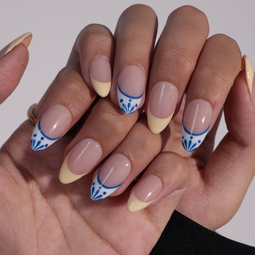 Butter Yellow French Tip Nails With Blue-Edged White Tips and Leaf Details