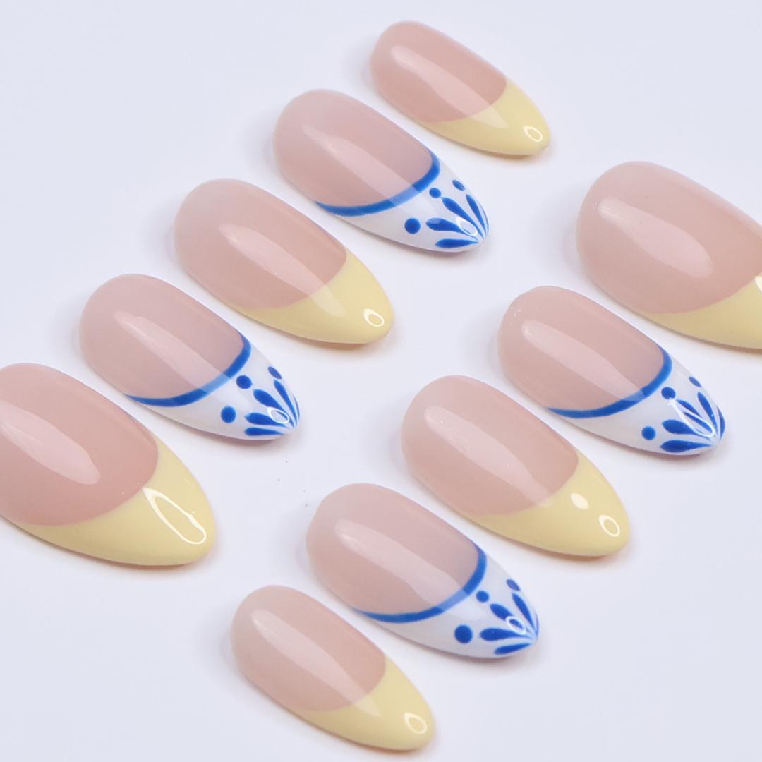 Butter Yellow French Tip Nails With Blue-Edged White Tips and Leaf Details