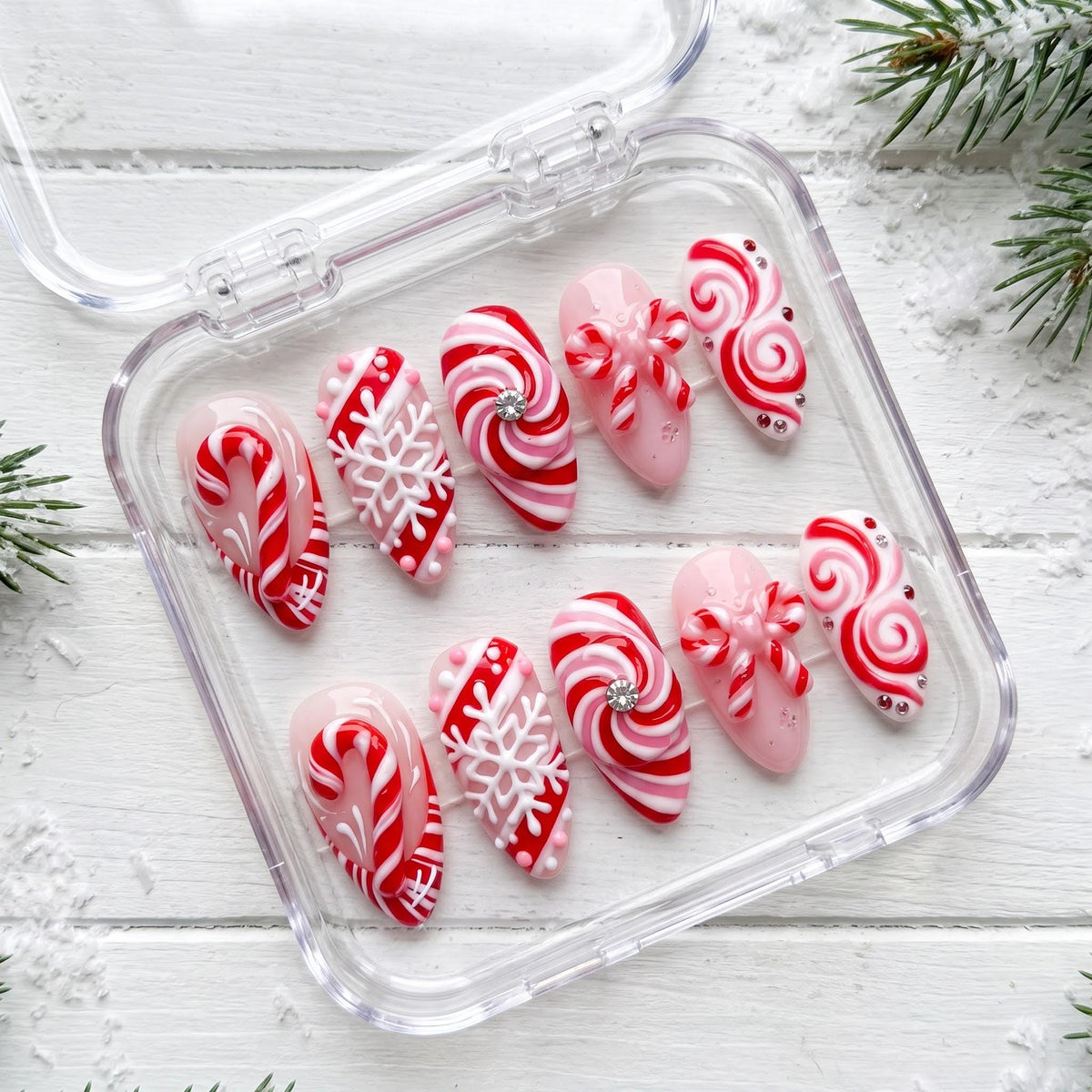 Candy Cane and Peppermint Swirl Snowflake Nails With Bows