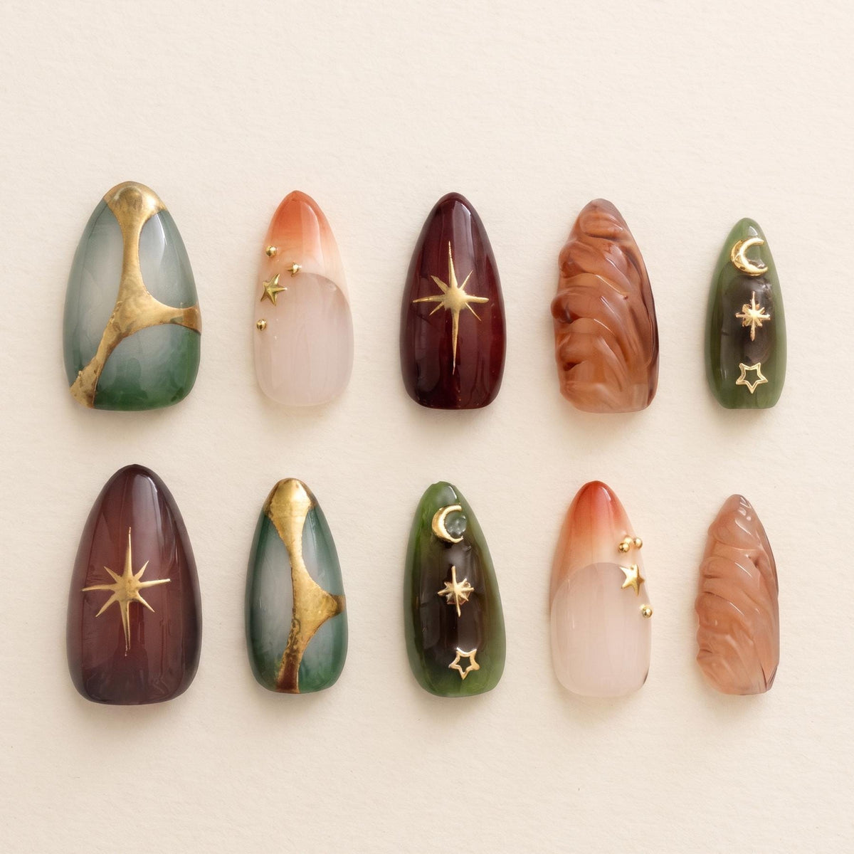 Celestial Emerald and Burgundy Nails with Gold Foil and Sculpted Details