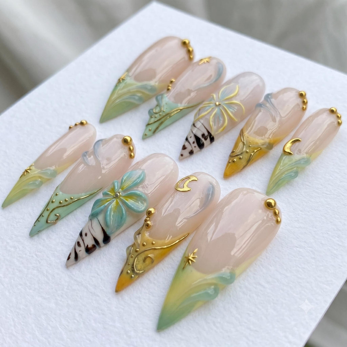 Celestial Floral French Tip Nail Set With Teal, Gold Moons and Starbursts