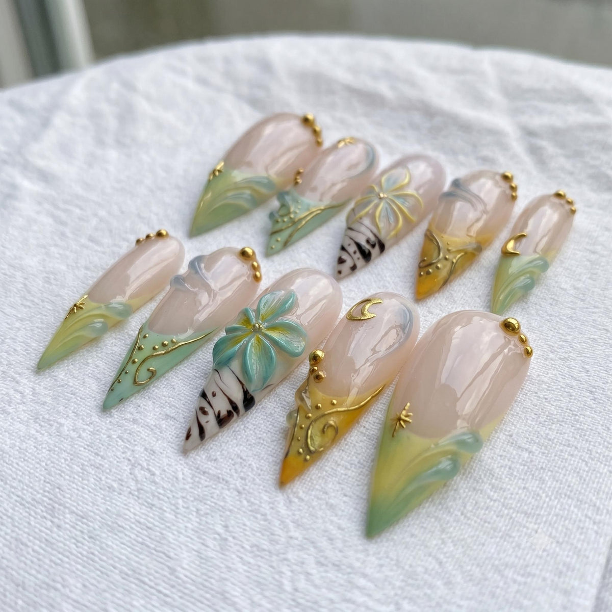 Celestial Floral French Tip Nail Set With Teal, Gold Moons and Starbursts