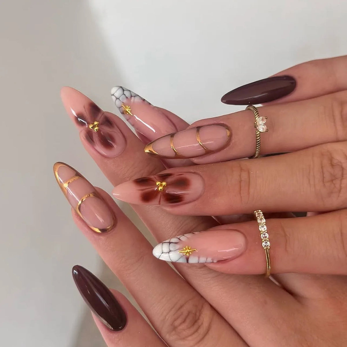 Chocolate Brown and Blush Pink Nails with Gold Outlines and Floral Accents