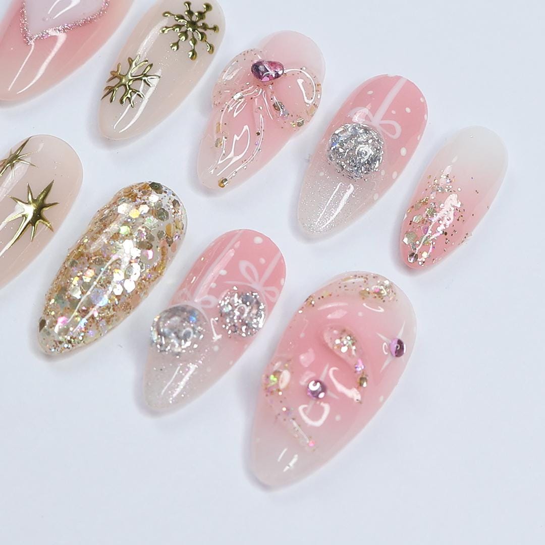 Christmas Pink Press-On Nails with Bows, Glitter, Hearts, and Gold Snowflakes
