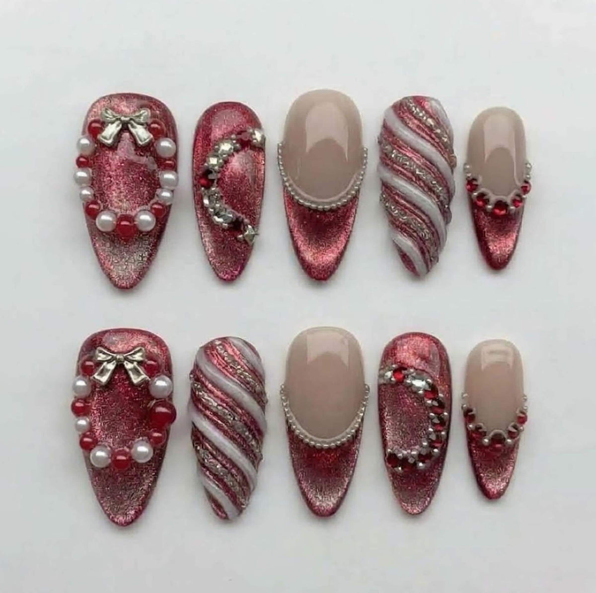 Christmas Ruby Red Cat Eye Nails With Pearl Bead Curves, Silver Bows and Swirls