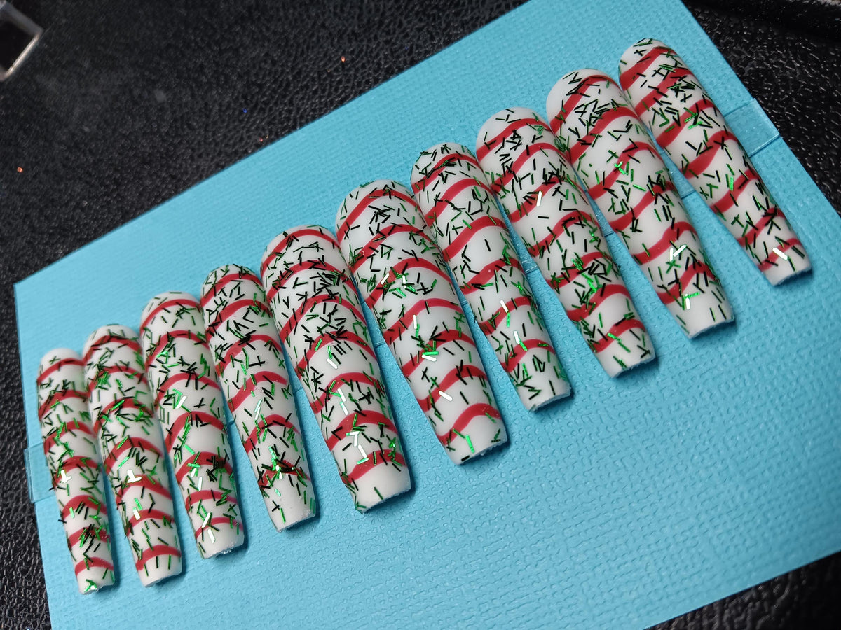 Christmas Tree Cake White Nails With Red Swirls and Green Sprigs