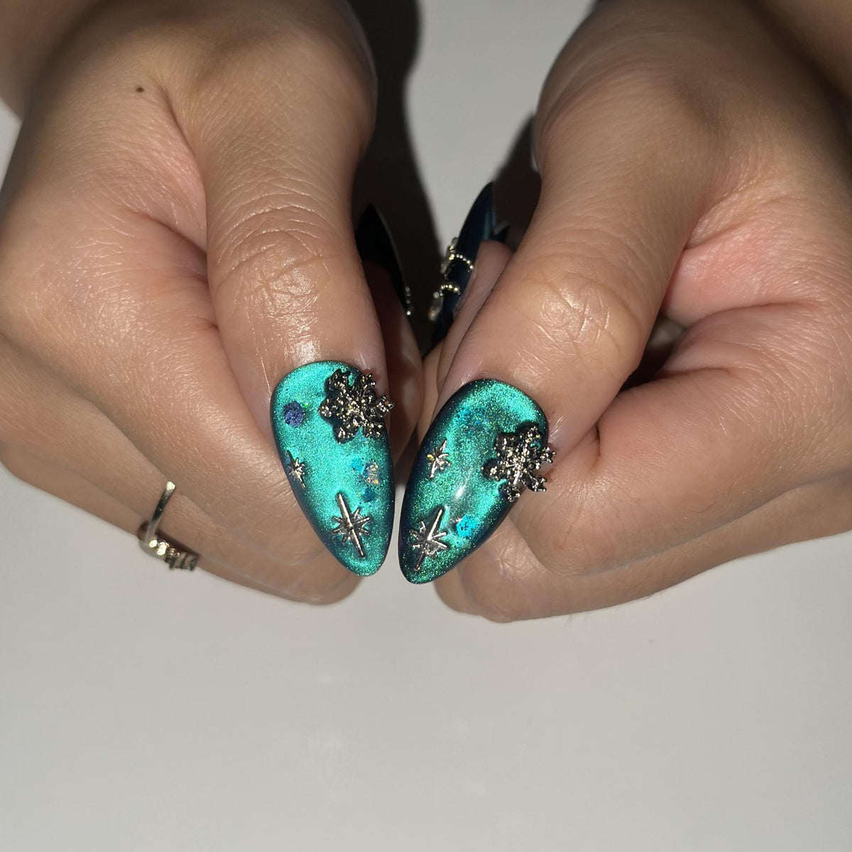 Christmas Winter Teal Cat Eye Press On Nails With Silver Snowflakes, Stars and Bow Charms