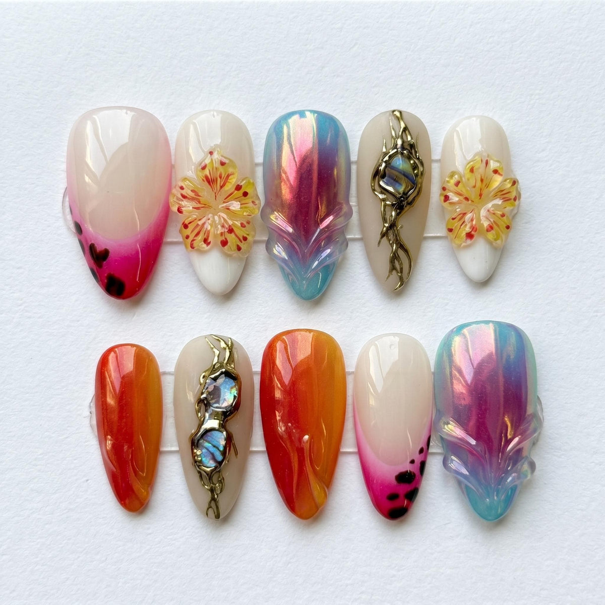 Chrome Aura Flower Press On Nails With Iridescent Accents and Blue Stones