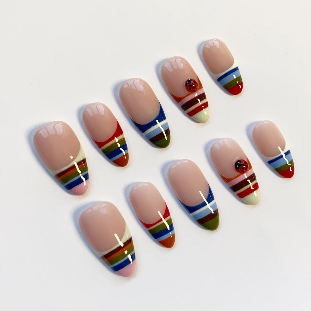 Colorful Striped French Tip Nails With Ladybug Accents