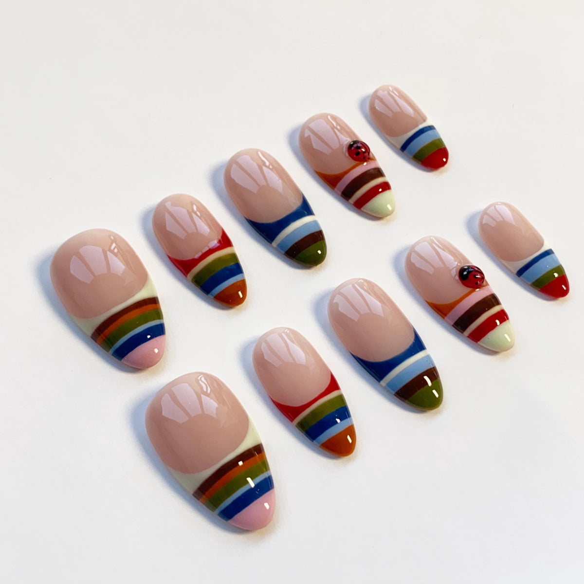 Colorful Striped French Tip Nails With Ladybug Accents