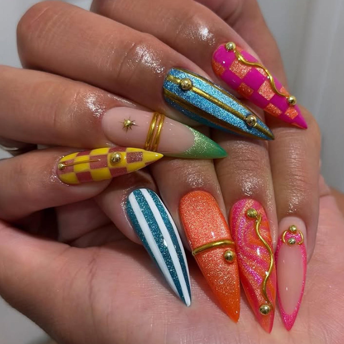 Colorful Y2K Checkerboard and Stripe Nails with Gold Accents