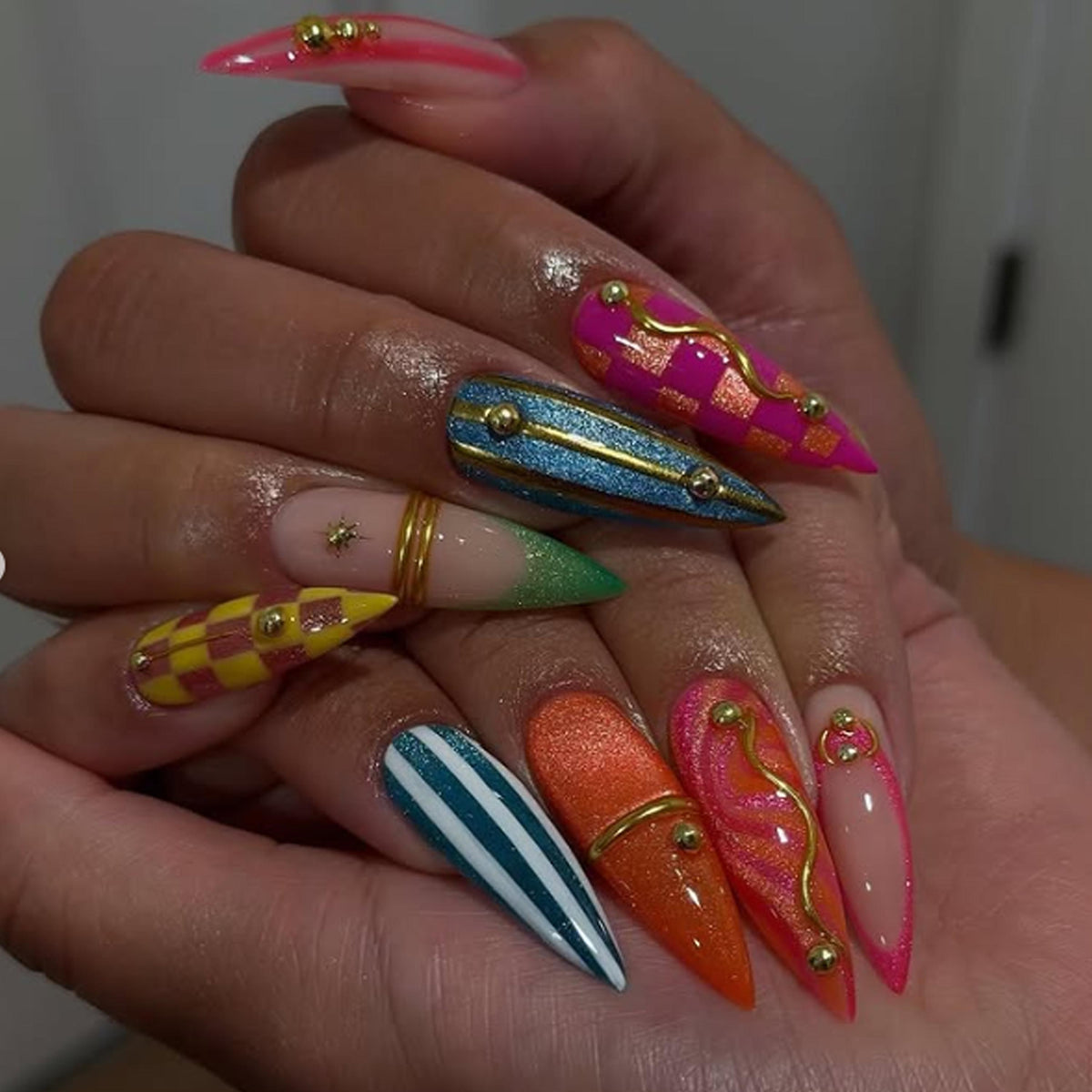 Colorful Y2K Checkerboard and Stripe Nails with Gold Accents