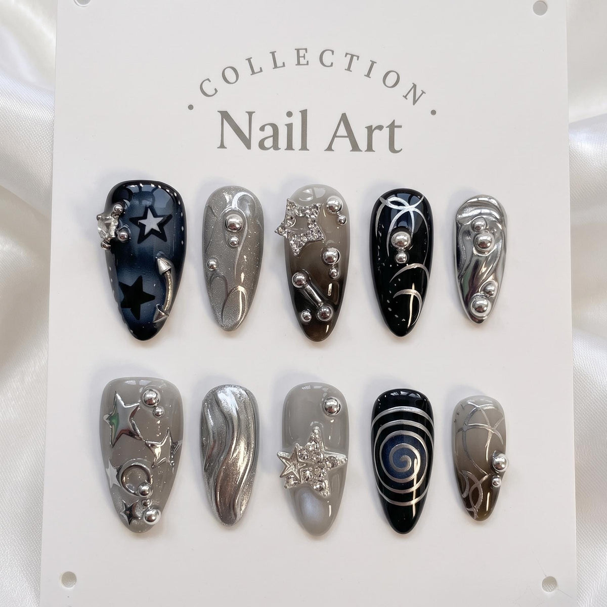 Dark Celestial Star and Moon Nails With Silver Chrome Swirls