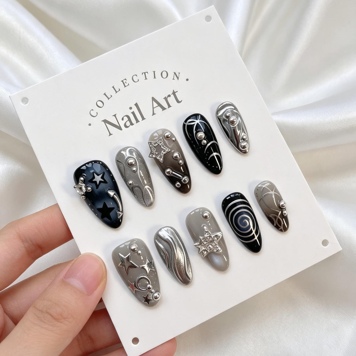 Dark Celestial Star and Moon Nails With Silver Chrome Swirls