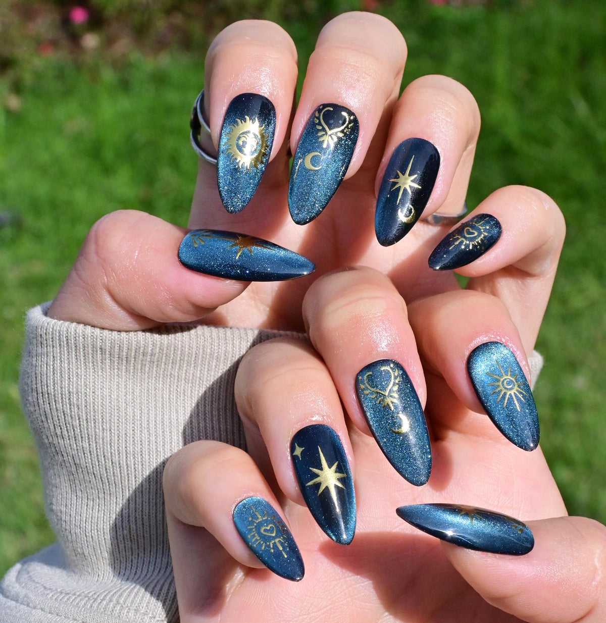 Dark Teal Cat Eye Celestial Nails with Gold Suns, Moons and Stars