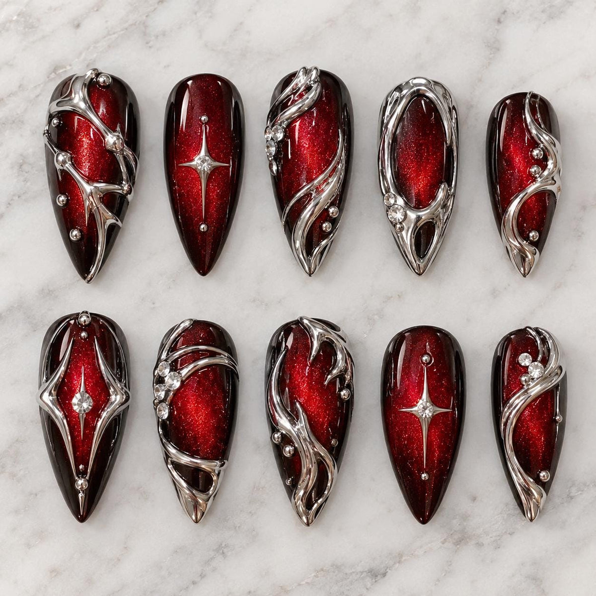 Deep Red Cat Eye Gothic Y2K Statement Nails With Raised Silver Swirls and Rhinestones