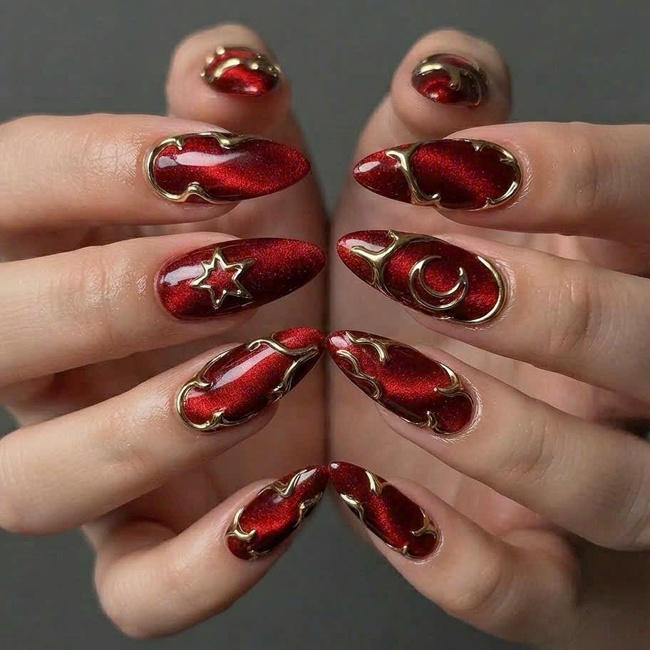 Deep Red Cat-Eye Press-On Nails With Gold Metallic Outlines and Celestial Accents