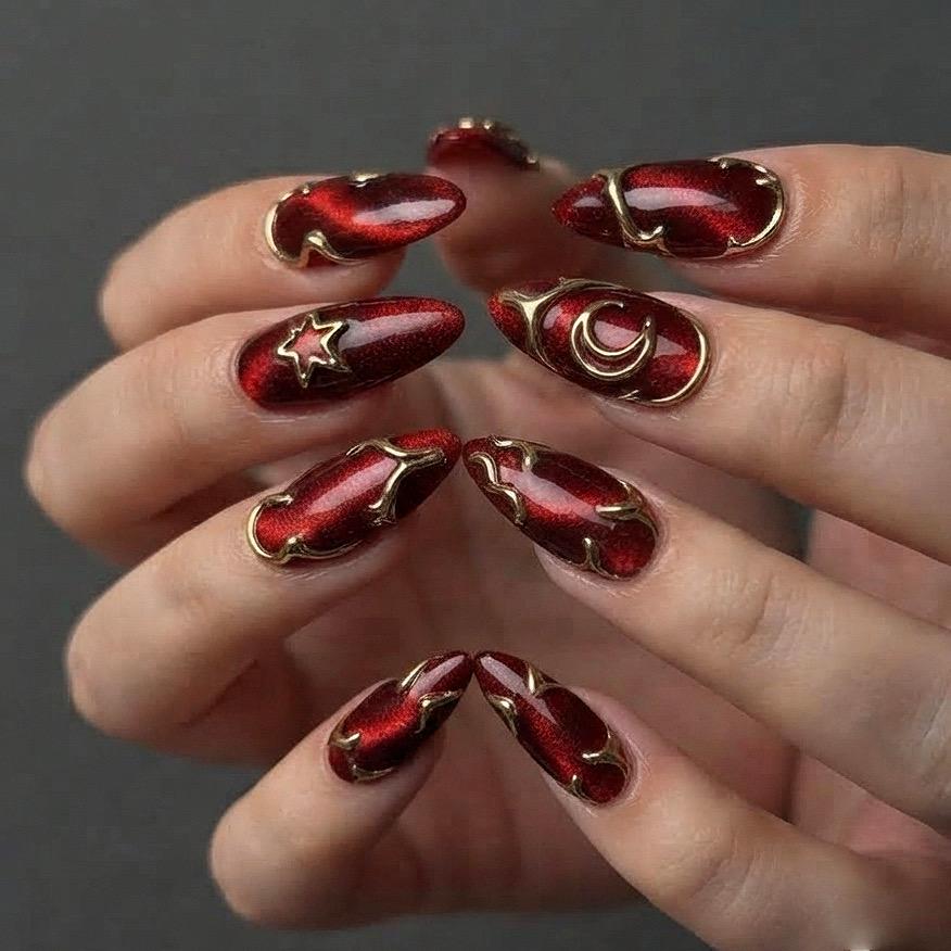 Deep Red Cat-Eye Press-On Nails With Gold Metallic Outlines and Celestial Accents